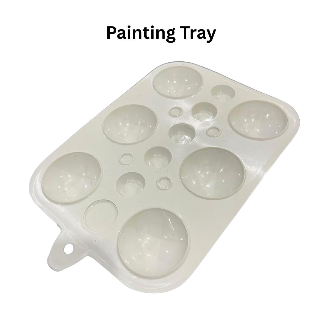 White plastic painting tray with multiple round wells for watercolor or acrylic paint mixing
