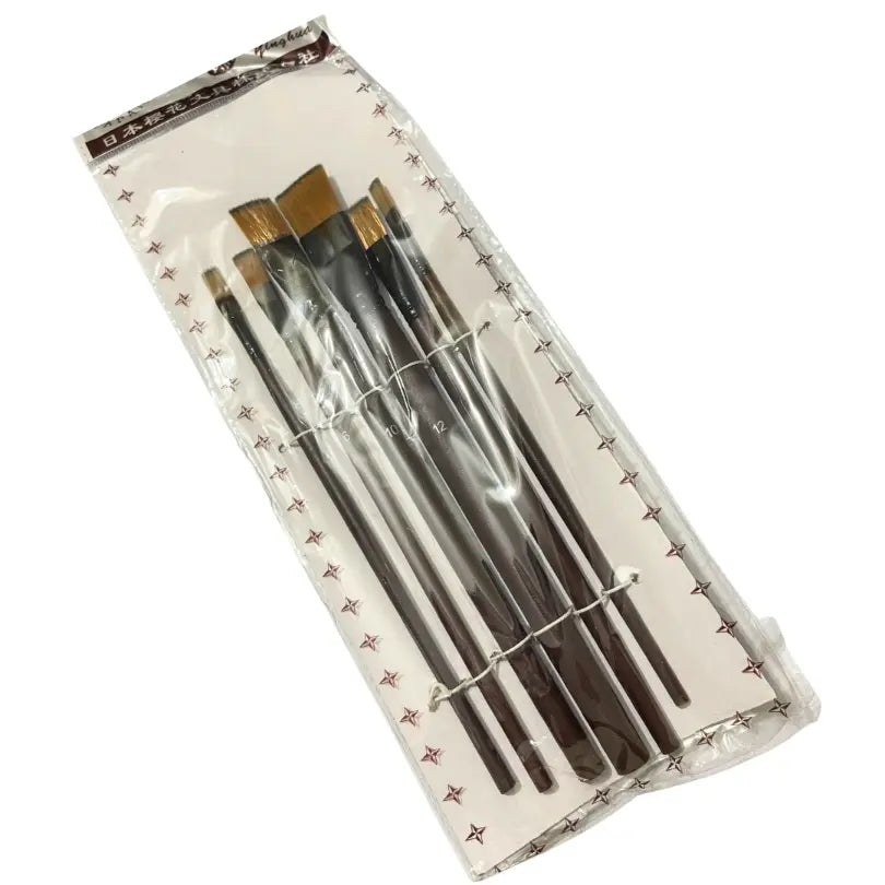 Set of Japanese art brushes with black handles and gold ferrules, packaged in clear plastic with star pattern