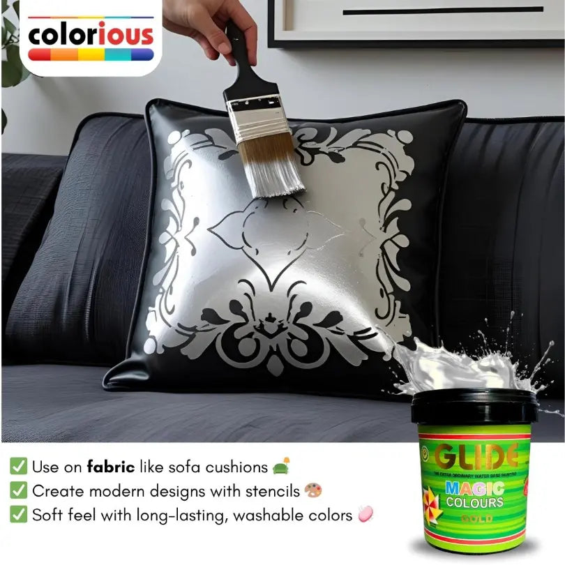 Painting black pillow with silver fabric paint using stencil, creating modern design on sofa cushion