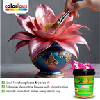 Hand painting vibrant pink lotus flower on ornate blue vase with magic gold paint, ideal for showpieces