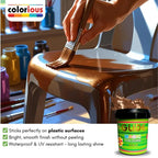 Hand painting plastic chair with glittery gold paint, showcasing smooth, waterproof finish for DIY crafts